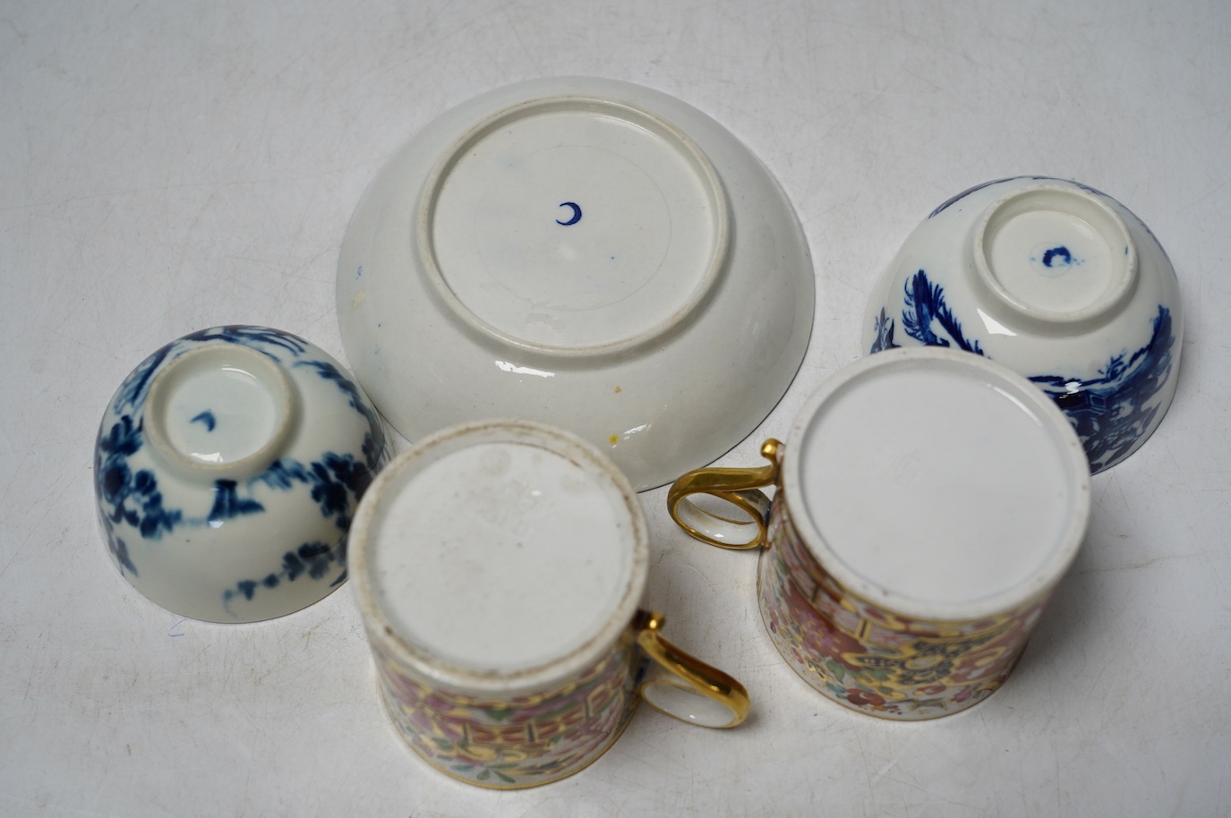 A pair of Barr Flight & Barr coffee cans and a group of Worcester to include a blue and white tea bowl and saucer and another teabowl. Condition - good